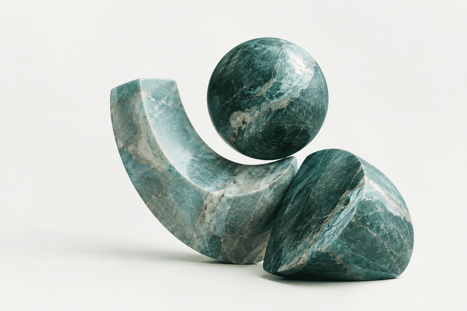 Green marble sculpture of a curled shape balancing a sphere beside a cube.